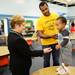 Ann Arbor Public Schools Superintendent Jeanice Kerr Swift greets one-year-old Jackson Gold as his dad Jason stands by after dropping off his second-grader on the first day of school at Logan Elementary School, Tuesday, September 3, 2013. Melanie Maxwell | AnnArbor.com